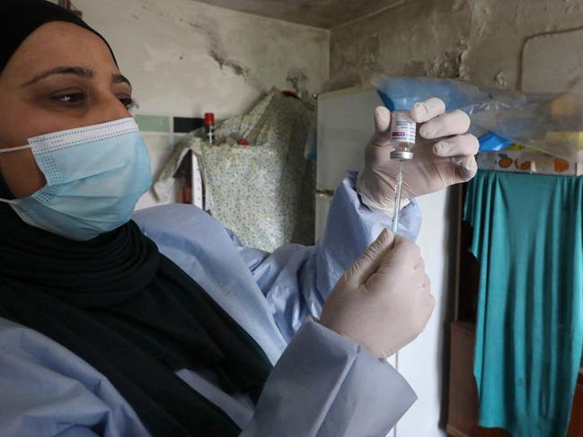 A nurse prepares a vial of the AstraZeneca vaccine, in Dura near Hebron in the occupied West Bank. Picture: AFP