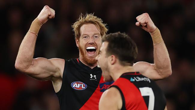 Andrew Phillips of the Bombers enjoys Zach Merrett’s goal. Picture: Michael Klein