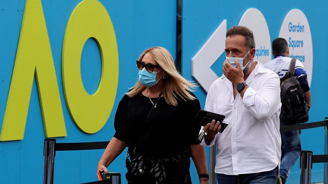 Spectators arrive at Melbourne Park wearing face masks. Picture: AFP