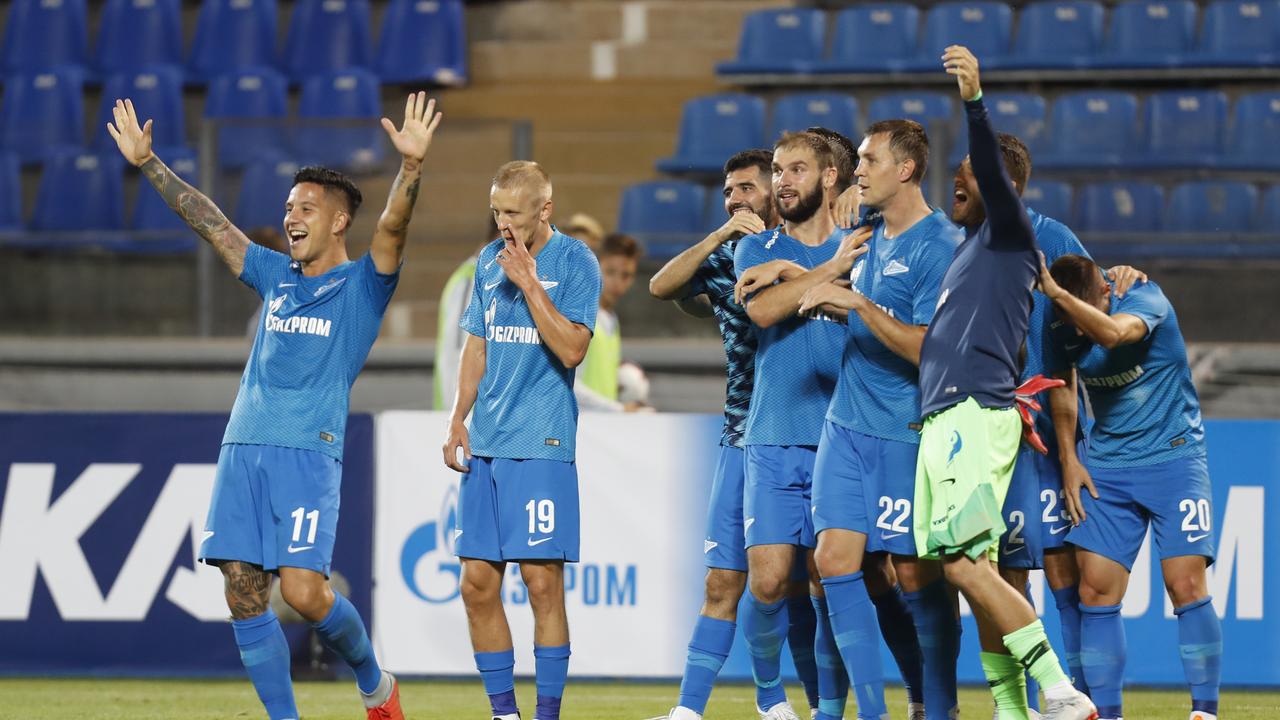 Zenit's players celebrate 8-1 victory in the UEFA Europa League, third qualifying round, second leg soccer match between FC Zenit and FC Dinamo Minsk at Petrovsky stadium in St.Petersburg, Russia, Thursday, Aug. 16, 2018. (AP Photo/Dmitri Lovetsky)
