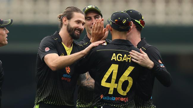 Kane Richardson celebrates a wicket against Pakistan before rain lashed Sydney.