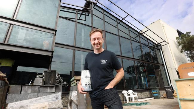 Ben Graham from Seven Miles Coffee Roasters outside the new Craft'd Grounds in Albion, which was opened late last year. Picture: Tara Croser