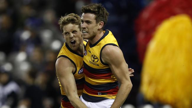 Paul Seesdman celebrates a goal with Rory Sloane.