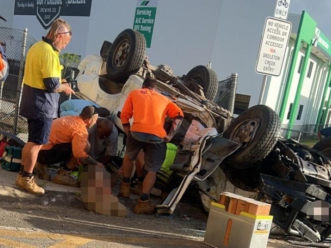 A freight train and car have collided at a level crossing on Swallow Rd, near the Bruce Hwy, at Bentley Park, on Monday morning, leaving two men with life-threatening injuries.