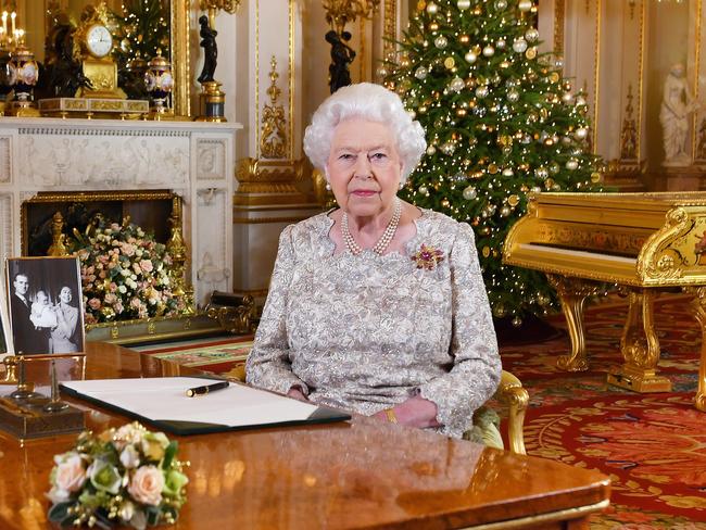 Queen Elizabeth II poses for a photo after she recorded her annual Christmas Day message, in the White Drawing Room at Buckingham Palace last year. Picture: Getty