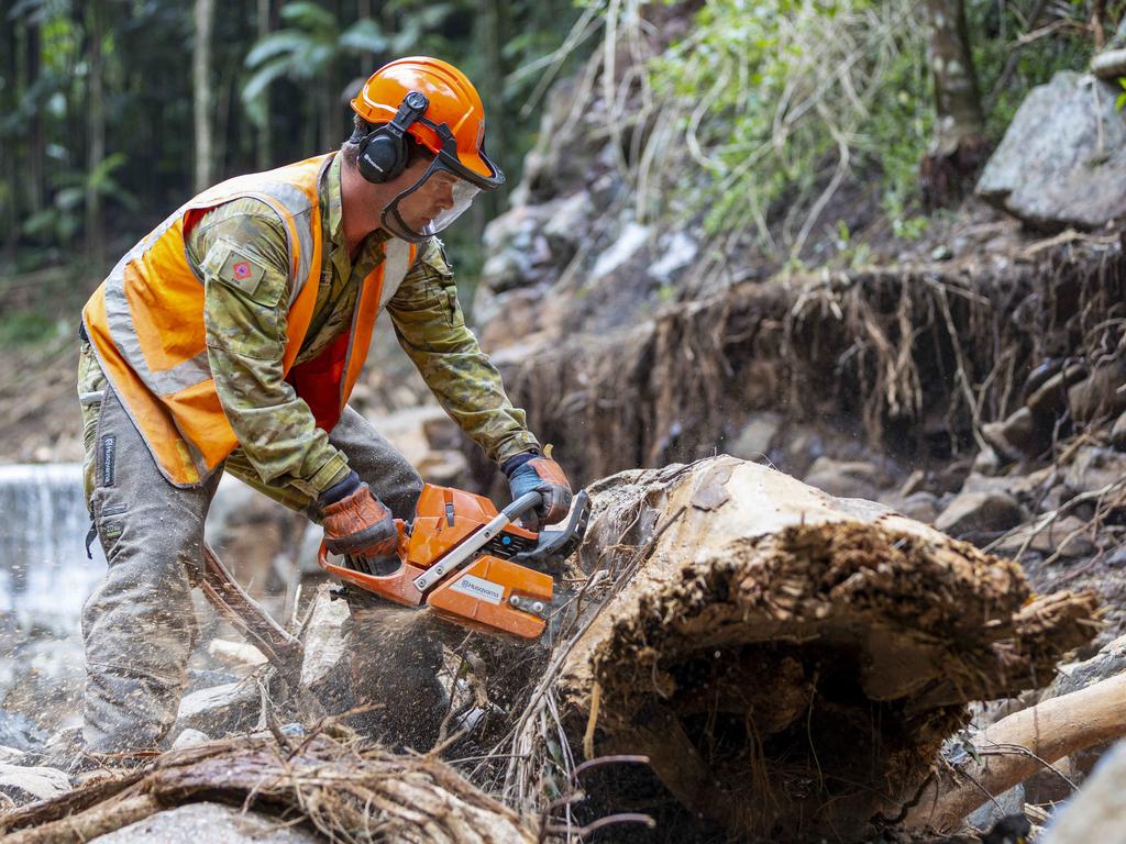 Australian Army sapper Lance Corporal Jack Dalrymple helping Lismore Shire Council clear debris from Mulgum Creek Weir in Nimbin. Picture: Defence