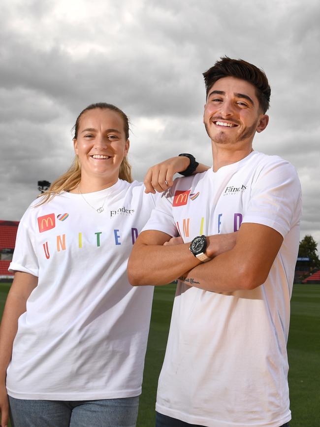 Reds’ women’s captain Isabel Hodgson and Josh Cavallo. Picture: Tricia Watkinson