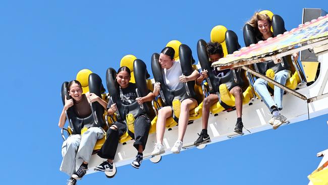 Samara Maza, 13, Tyla-May Gilmartin, 12, and Emma Lemke, 12, get a trill riding the Space Roller on the final day of the Cairns Show in 2024. Picture: Brendan Radke