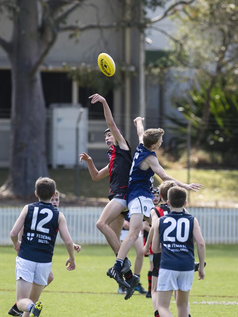 Andre Diem (left) of South Toowoomba Bombers and Nicholas Jensen of Coolaroo in U14 AFL Darling Downs grand final at Rockville Park, Saturday, September 2, 2023. Picture: Kevin Farmer