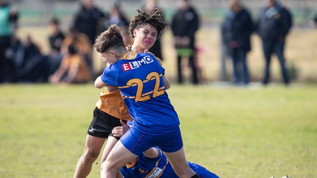 Country’s Morgan Carter tackled by Sydney’s Wilson Ruthven. Picture: Julian Andrews