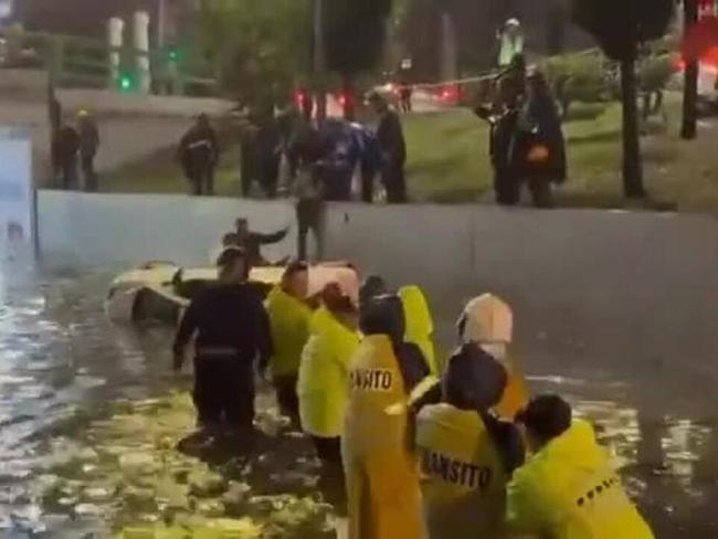 Workers See the Funny Side as Attempt to Pull Car Dunks Them in Floodwater