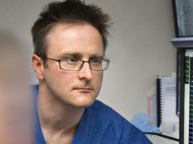 Cardiac surgeon Andrew McGavigan has been arrested and charged with possessing child exploitation material.