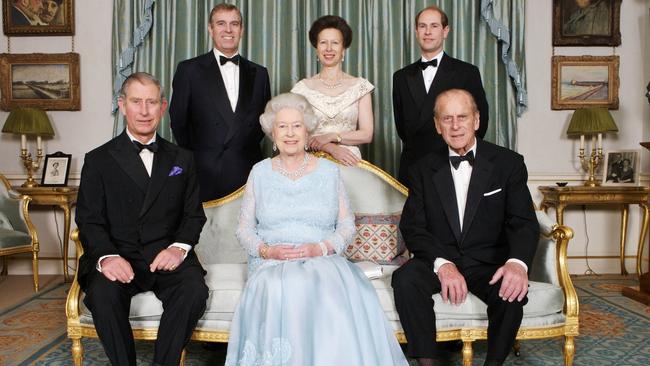 Queen Elizabeth II and Prince Philip, Duke of Edinburgh, pictured with their children; Prince Charles (left foreground), Prince Edward (right background), Princess Anne (centre background) and Prince Andrew (left background), at Clarence House in London, on 18 November 2007. Picture: AFP