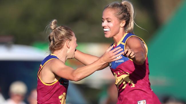 Kate McCarthy of the Lions celebrates her goal with Kaitlyn Ashmore. Pic Darren England