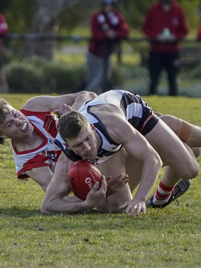 Rhys Dempster with the ball for Narre Warren.