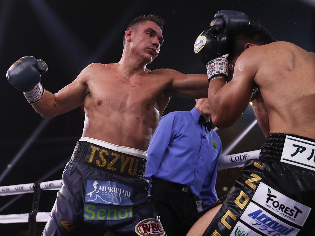 Tim Tszyu punches Takeshi Inoue during their fight at Sydney’s Qudos Bank Arena. Picture: Mark Kolbe/Getty Images