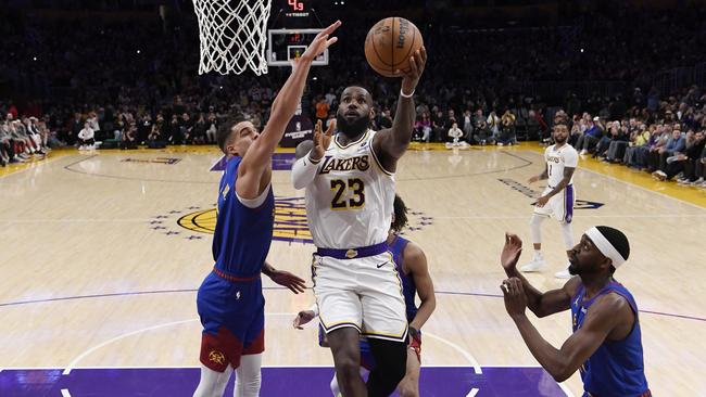 LeBron James scores his 40,000th career point during the first half against the Denver Nuggets. (Photo by Kevork Djansezian/Getty Images)