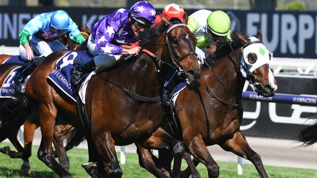 MELBOURNE, AUSTRALIA - NOVEMBER 04: Damien Oliver riding #9 Bermadez wins race 7, the Melbourne Cup Carnival Country Final during 2021 Oaks Day at Flemington Racecourse on November 04, 2021 in Melbourne, Australia. (Photo by Vince Caligiuri/Getty Images)