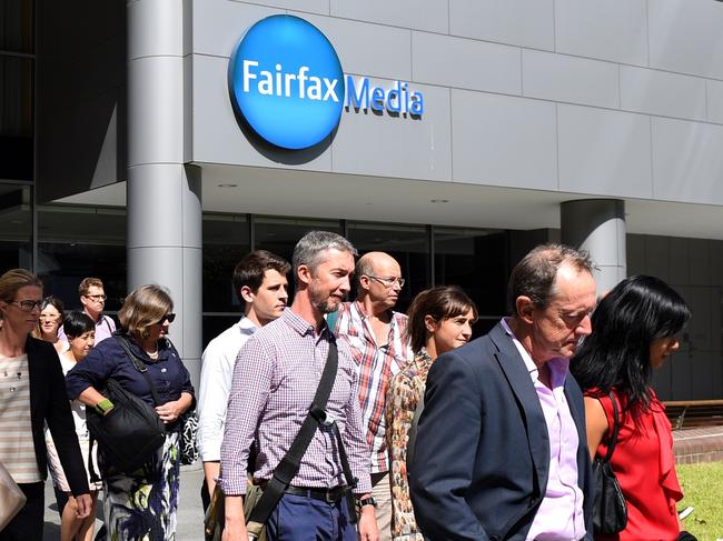 Editorial staff are seen walking out of Fairfax Media headquarters in Sydney, Thursday, March 17, 2016. The company announced today 120 editorial positions would be cut, and in response staff voted to walk off the job until Monday. (AAP Image/Dan Himbrechts) NO ARCHIVING