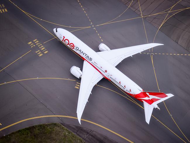 SYDNEY, AUSTRALIA - NOVEMBER 16: A Boeing 787 Dreamliner aircraft, Qantas flight QF100 prepares to take off from Kingsford Smith International airport as part of Qantas 100th Birthday celebrations on November 16, 2020 in Sydney, Australia. Australia's national airline Qantas is celebrating 100 years. (Photo by David Gray#JM/Getty Images for Destination New South Wales/Qantas)