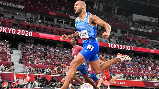 Italy's Lamont Marcell Jacobs celebrates as he crosses the finish line to win the men's 100m final. Picture: Jewel Samad/AFP