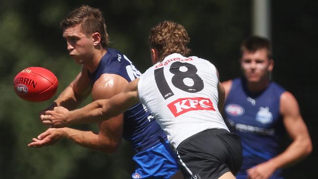 Will Phillips under pressure from Finlay Macrae. Picture: Daniel Pockett/Getty Images