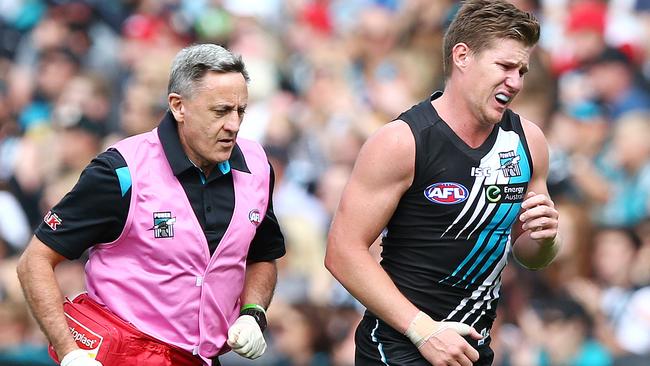 AFL - Port Adelaide v St Kilda at Adelaide Oval. Matt White leaves the oval with a right shoulder injury. Photo Sarah Reed.