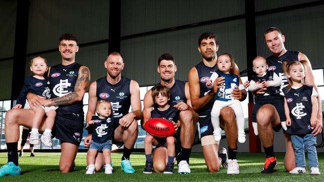 PLEASE CREDIT: AFL PHOTOS Group Photo - Zac Williams (with daughter Ayla), Sam Docherty (with daughter Ruby), George Hewett (with son Henry), Jack Martin (with daughter Rosie), Mitch McGovern (with son Hamish and daughter Margot) MELBOURNE, AUSTRALIA - FEBRUARY 07: during the 2024 Carlton Blues Official Team Photo Day at Ikon Park on February 07, 2024 in Melbourne, Australia. (Photo by Dylan Burns/AFL Photos)