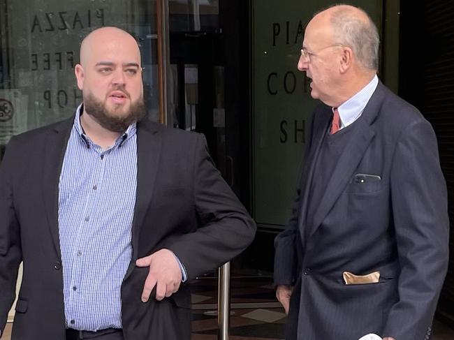 Walker (left) outside court with his lawyer. Picture: Odessa Blain.