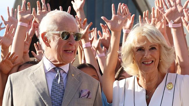 SYDNEY, AUSTRALIA - OCTOBER 22: King Charles III and Queen Camilla pose for a photo with students at the Sydney Opera House on October 22, 2024 in Sydney, Australia. The King's visit to Australia is his first as monarch, and the Commonwealth Heads of Government Meeting (CHOGM) in Samoa will be his first as head of the Commonwealth. (Photo by Chris Jackson/Getty Images)