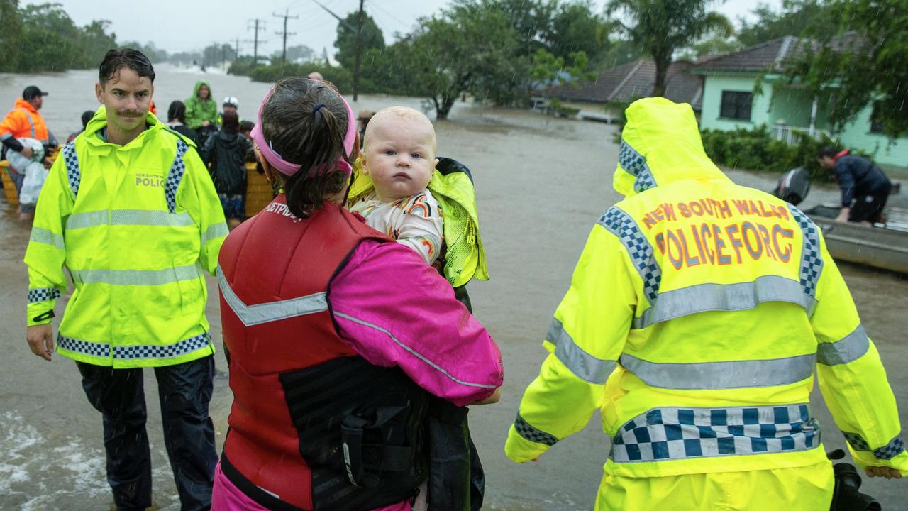 Police rescue residents from the Lismore CBD today. Picture: Media Mode