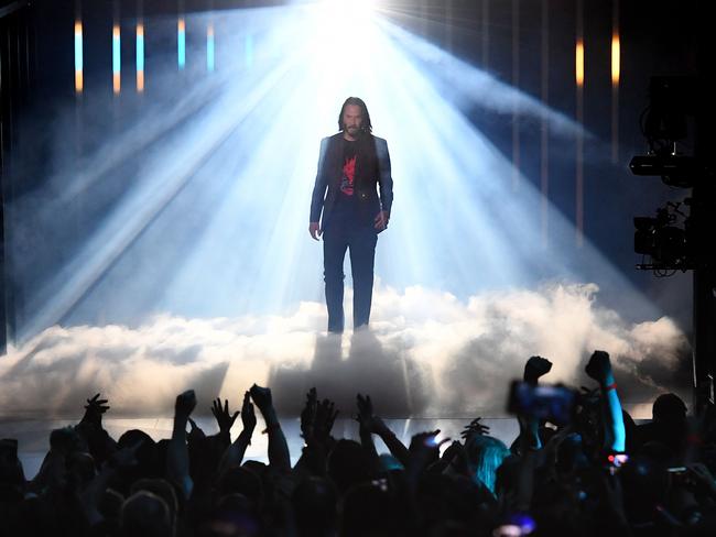 Fans went wild as Reeves took to the stage in a spectacular display of light and smoke. Picture: AFP