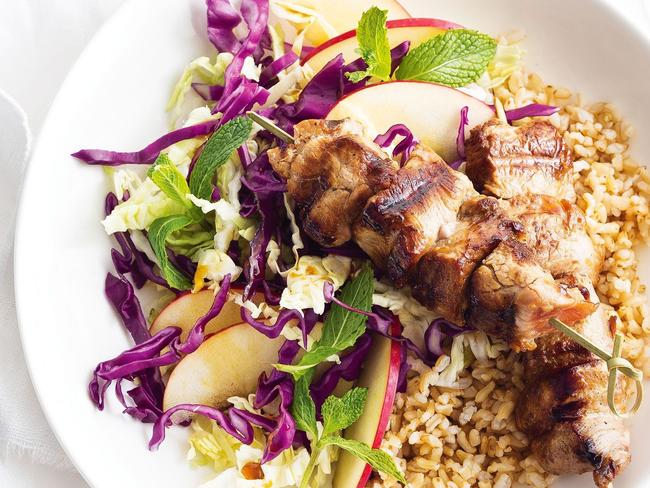 Ginger and tamari pork skewers with cabbage and apple salad.