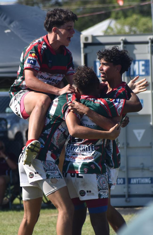 Bluff United players celebrate the match-winning try in the under-15 grand final at the Warba Wangarunya Rugby League Carnival.