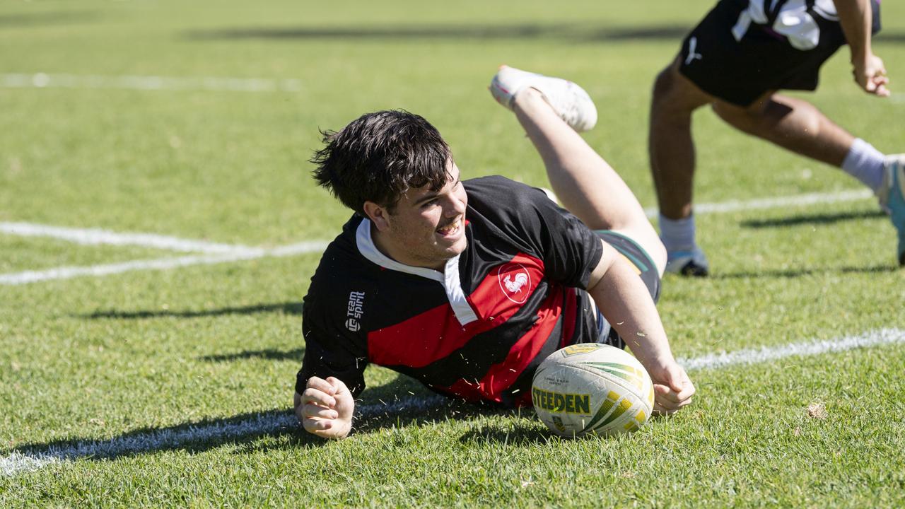 Noah Whitehouse celebrates a try for Roosters against Royals in C-grade.