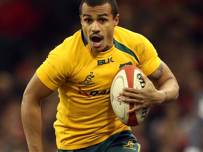 CARDIFF, WALES - NOVEMBER 30: Will Genia of Australia runs with the ball during the international match between Wales and Australia at the Millennium Stadium on November 30, 2013 in Cardiff, Wales. (Photo by David Rogers/Getty Images)