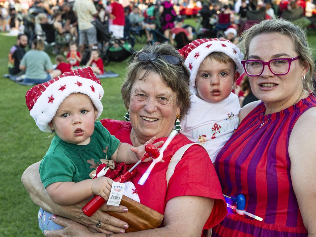 Lyn Elliott holding Fletcher Beaman with Shakira Elliott (right) holding Jonty Beaman at Triple M Mayoral Carols by Candlelight, Sunday, December 8, 2024. Picture: Kevin Farmer