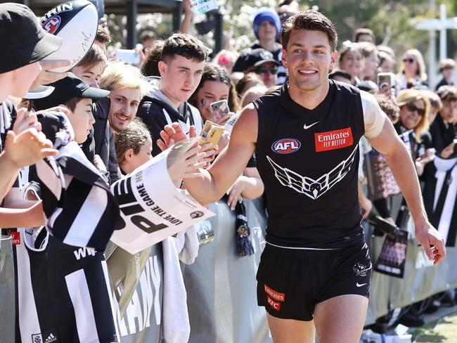 Patrick Lipinski high-five fans after a training session at Olympic Park, Melbourne. Picture: Michael Klein.