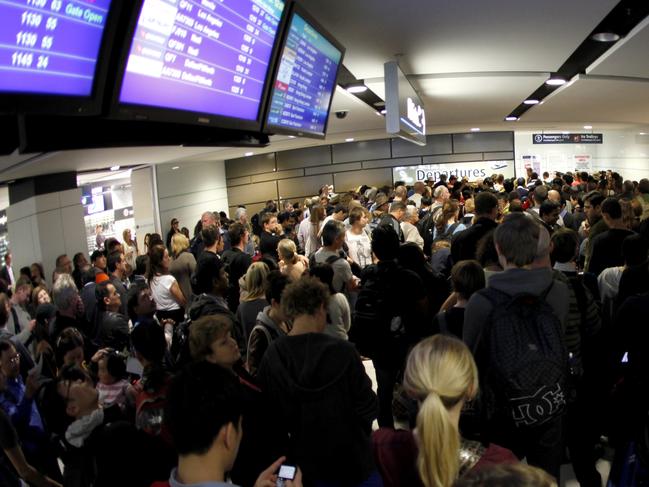 The queue of people waiting to get through customs. Airport Chaos.........A major power failure at Sydney International airport left thousands of passengers stranded.