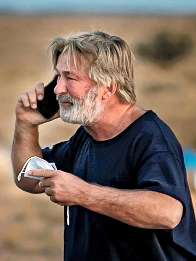 A distraught Alec Baldwin lingers in the parking lot outside the Santa Fe County Sheriff's offices on Camino Justicia after being questioned on Oct. 20, 2021 about a shooting when a gun misfired earlier in the day on a local movie set. Picture: Jim Weber/Santa Fe New Mexican