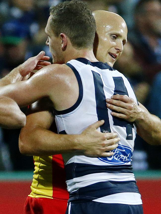 Gary Ablett and Joel Selwood hug after last year’s clash in Geelong. Picture: Colleen Petch.