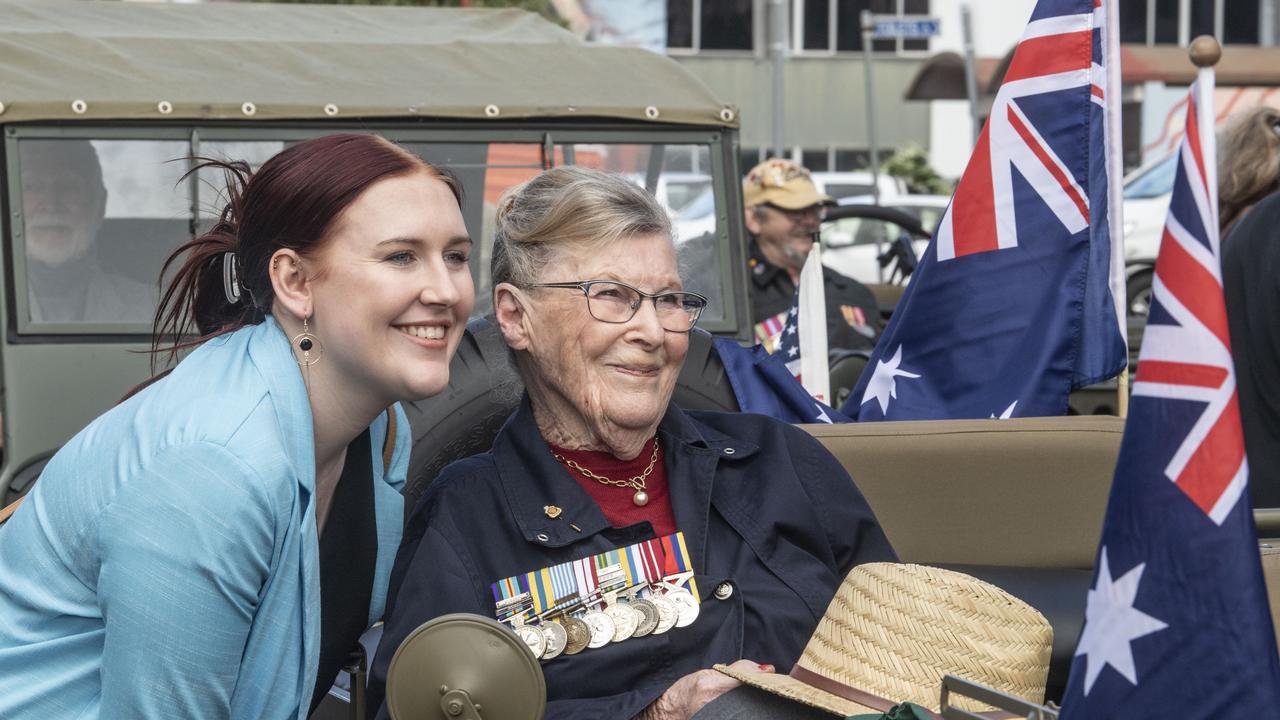 Celeste Dellit and her grandmother Jean Dellit. The first time Jean wears her late husband's medals. (Kenneth Dellit served in Korea). Assembly in Neil St for the mid morning parade on ANZAC DAY. Tuesday, April 25, 2023. Picture: Nev Madsen.