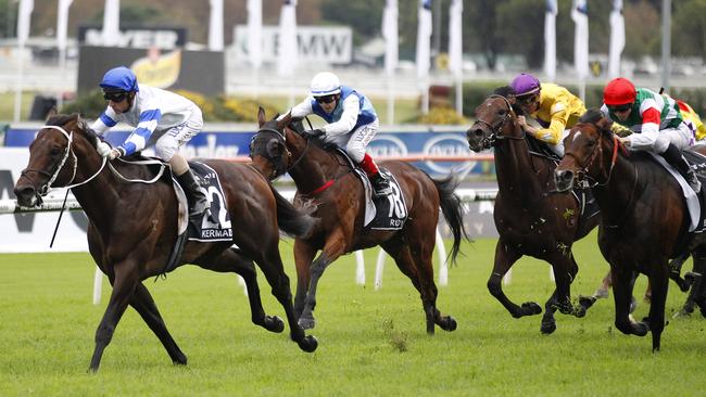 Kermadec defeated Real Impact (red cap), ridden by James McDonald, in the 2015 Doncaster Mile. Picture: David Moir