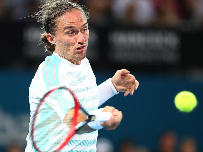 Alexandr Dolgopolov plays a forehand in his match against Rafael Nadal.