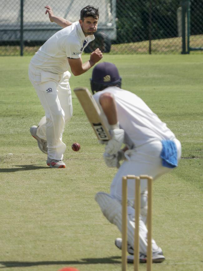 Premier Cricket: James Nanopoulos rolls the arm over for Frankston Peninsula. Picture: Valeriu Campan