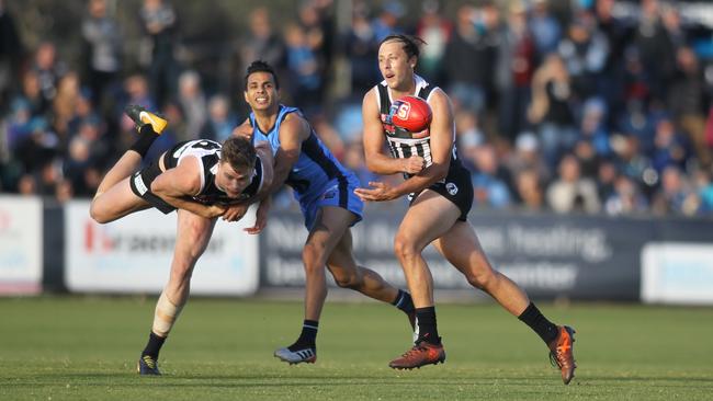 Port SANFL captain Cam Sutcliffe handballs during the match with Sturt. Picture: AAP/Dean Martin