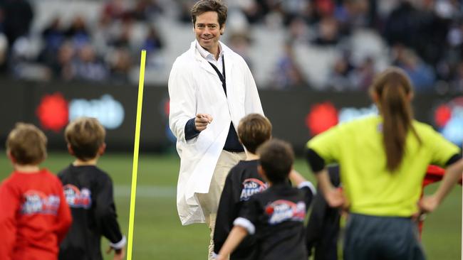 AFL Round 14. 24/06//2018. Collingwood v Carlton at the MCG. AFL CEO Gillon McLachlan goal umpires Auskick match at halftime . Pic: Michael Klein