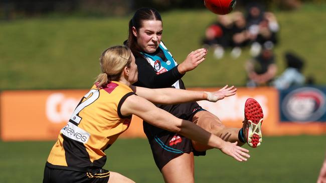 St Mary’s Elyssa Rees gets a kick away under pressure from Tessa Hankinson of Heidelberg. Picture: Hamish Blair