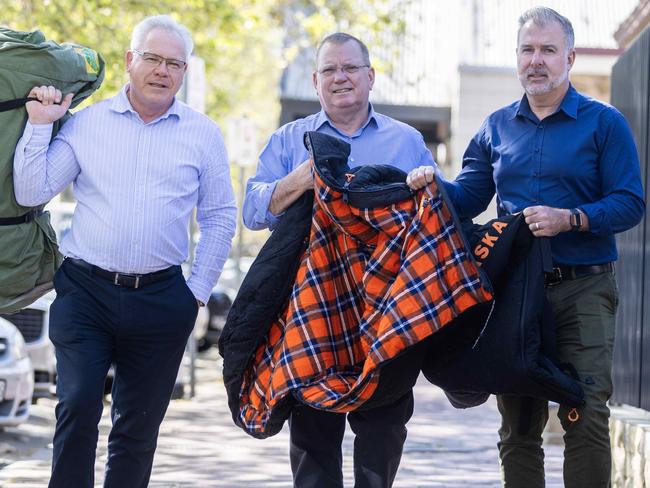 11 September 2023: Mitsubishi Motors CEO Shaun Westcott, Chris Burns - CEO Hutt st and  Dan Demaria  with swags and sleeping bag out side the Hutt St Centre in Adelaide. Picture Kelly Barnes