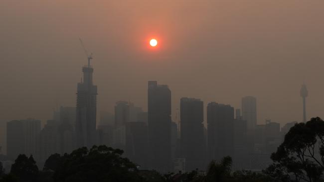 The Sydney skyline seen from Balmain as winds blow smoke from bushfires over the CBD on Friday morning. Picture: Dylan Coker/AAP